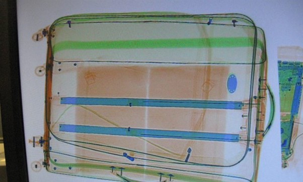 Example of two packages of cocaine hidden in the lining of a suitcase